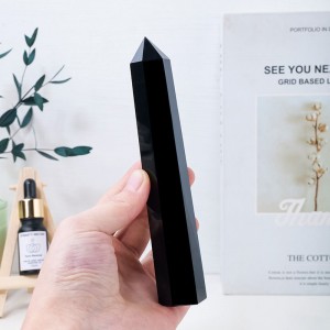 Obsidian prism shaped pillar receives energy and is handmade from raw stone