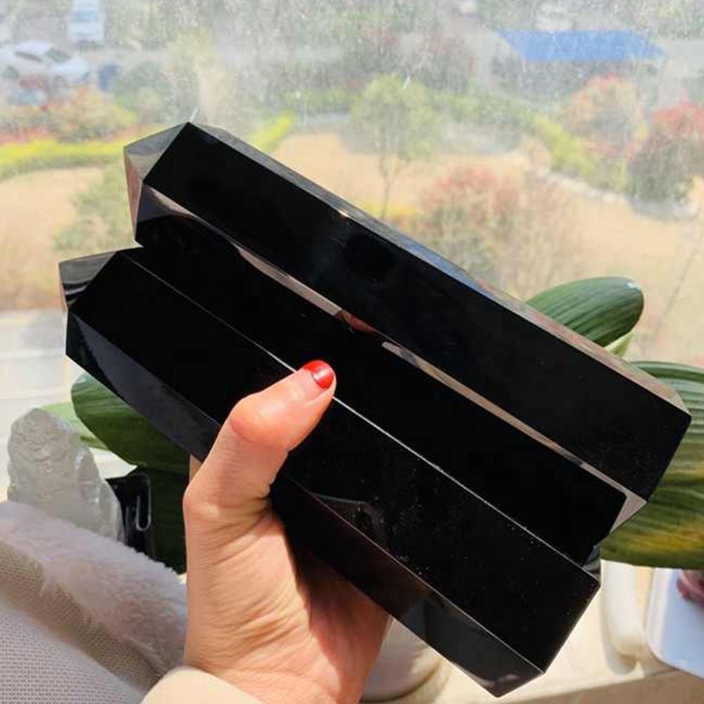 Obsidian prism shaped pillar receives energy and is handmade from raw stone