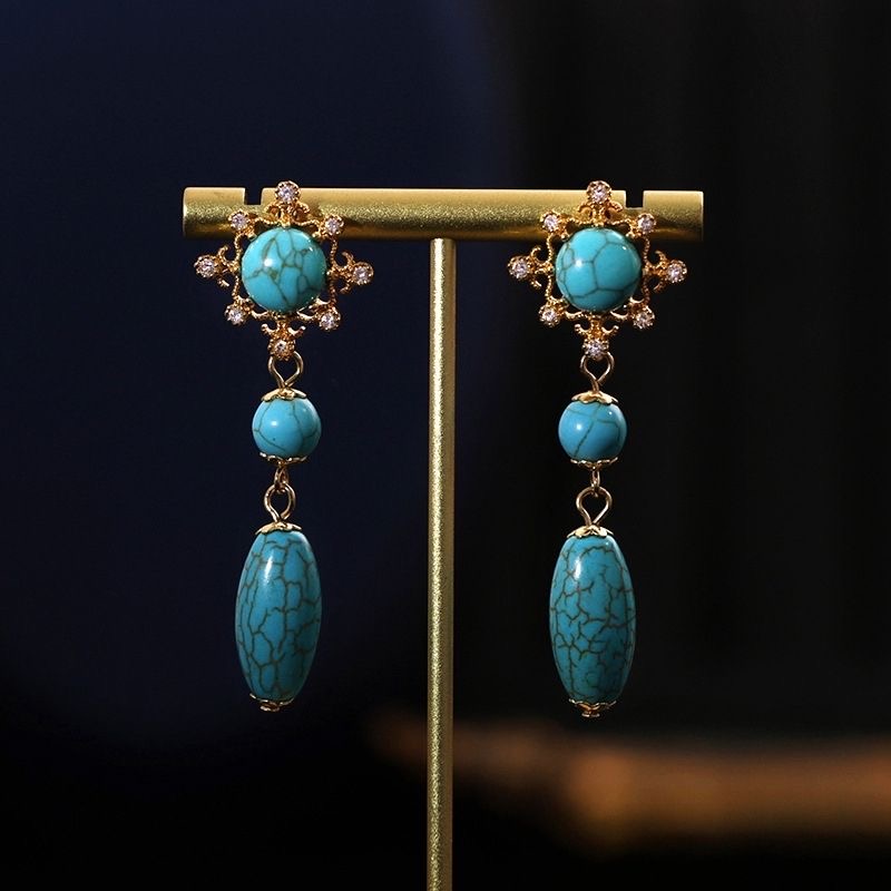 Trendy women's palace style hollow turquoise long pendant earrings