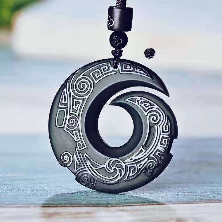 Obsidian transport pendant with Chinese elements paired with unisex design