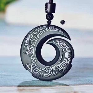 Obsidian transport pendant with Chinese elements paired with unisex design