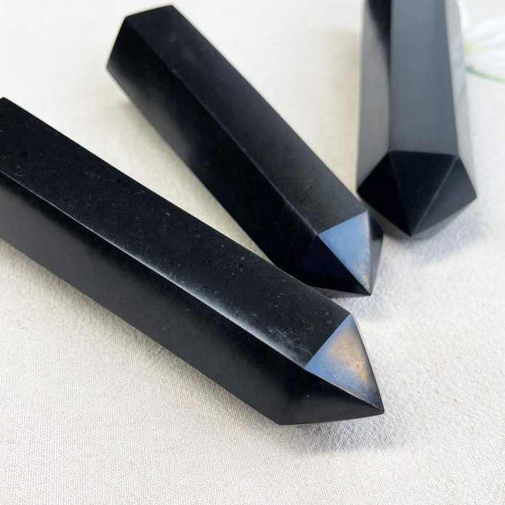 Obsidian prism shaped pillar receives energy and is handmade from raw stone