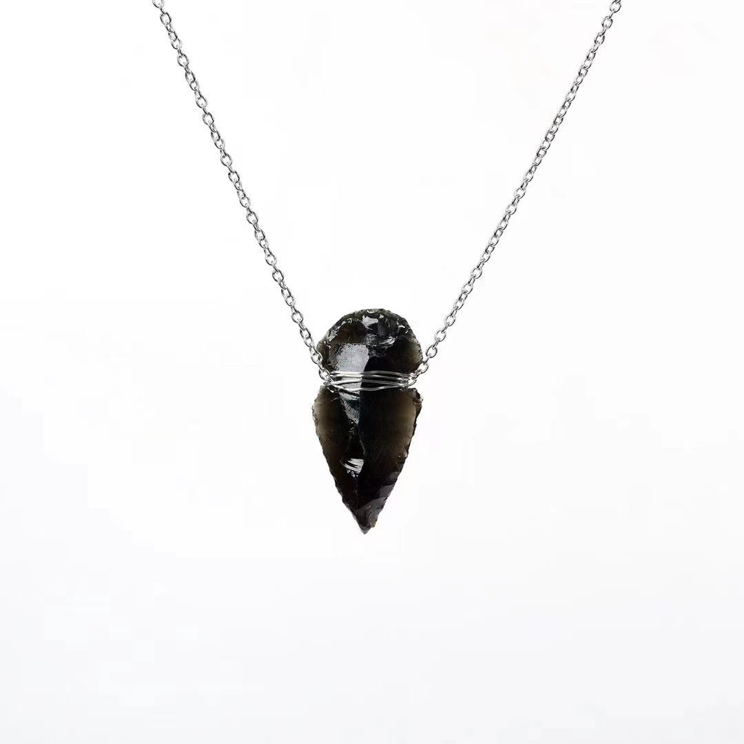 Handcrafted obsidian Indian arrowhead rough stone