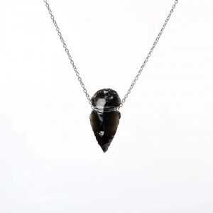 Handcrafted obsidian Indian arrowhead rough stone