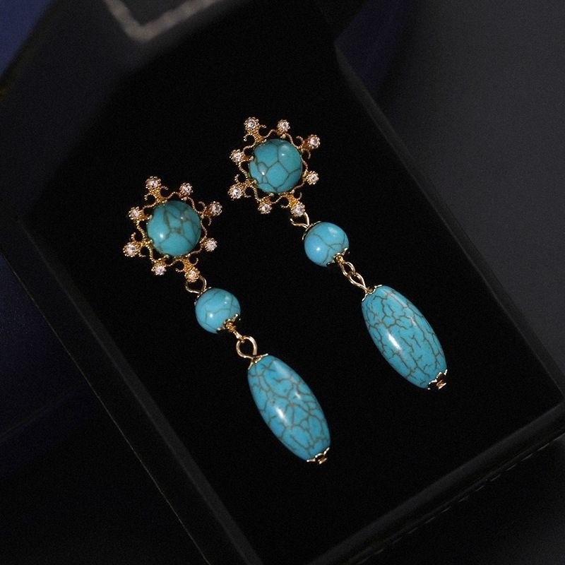 Trendy women's palace style hollow turquoise long pendant earrings
