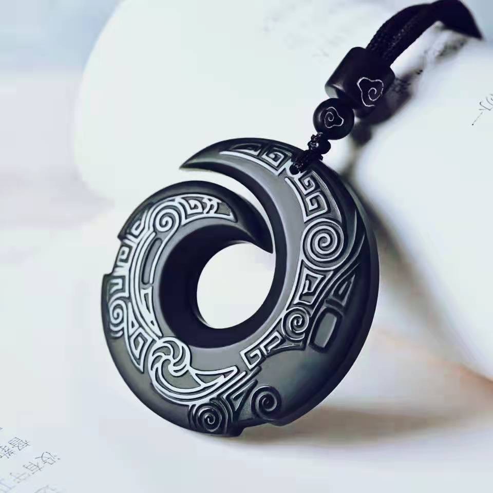 Obsidian transport pendant with Chinese elements paired with unisex design