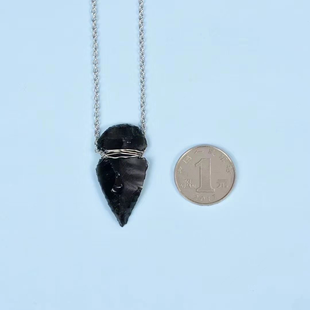 Handcrafted obsidian Indian arrowhead rough stone