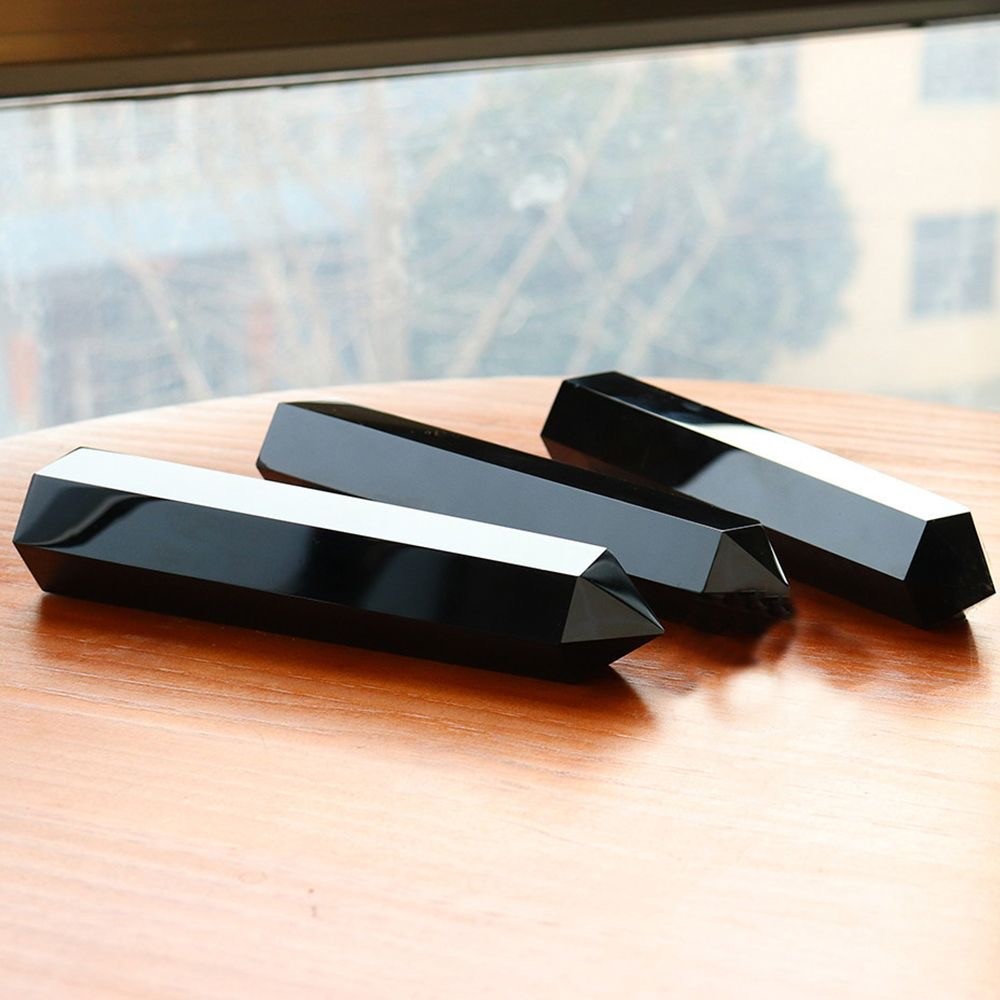 Obsidian prism shaped pillar receives energy and is handmade from raw stone